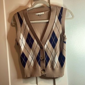 This cute vest needs a new home new never been worn